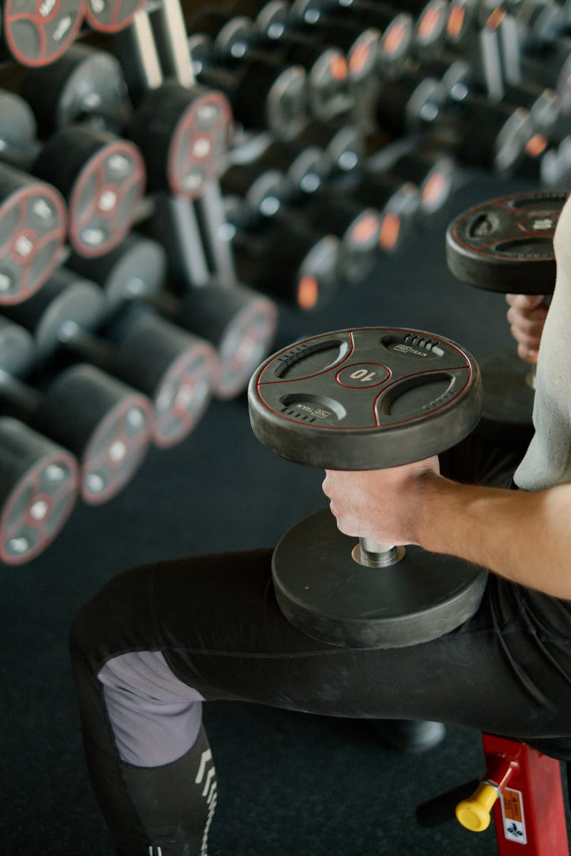 Person using adaptive fitness equipment with technology assistance for inclusive exercise