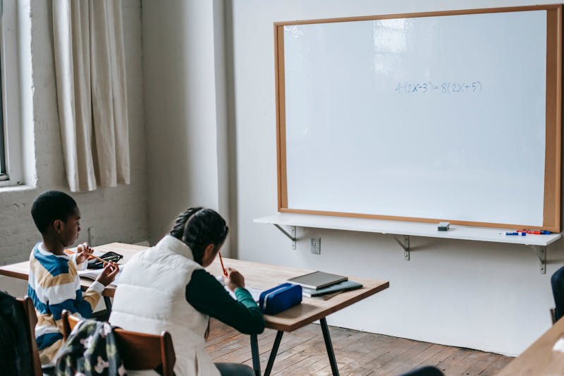 Student using AI-powered learning tools in a classroom setting