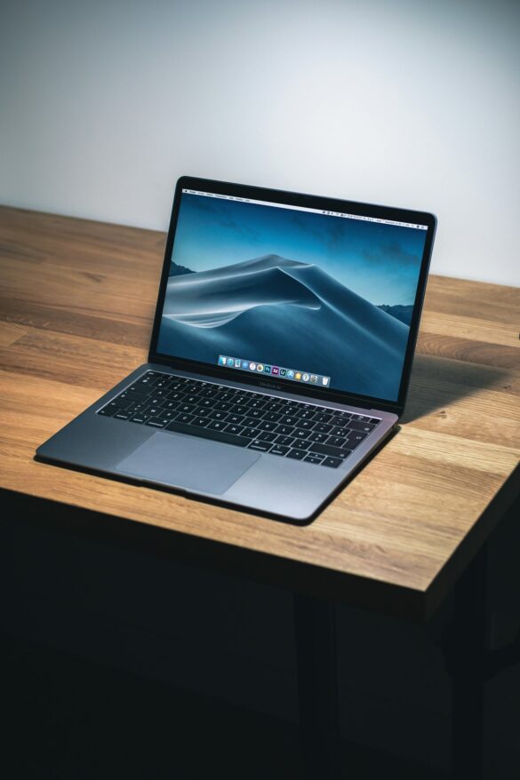 Budget laptop on a desk with coffee cup, showing affordable technology options