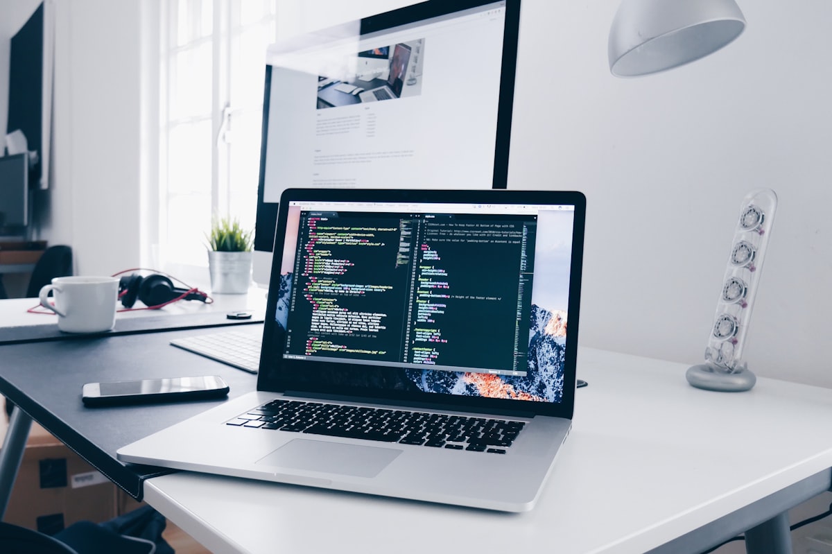 Person working efficiently on a laptop at a tidy home office desk