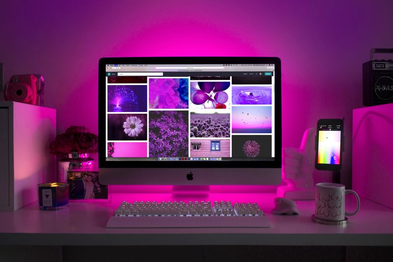 Portable tech accessories and gadgets arranged on desk showing popular gift options under $100