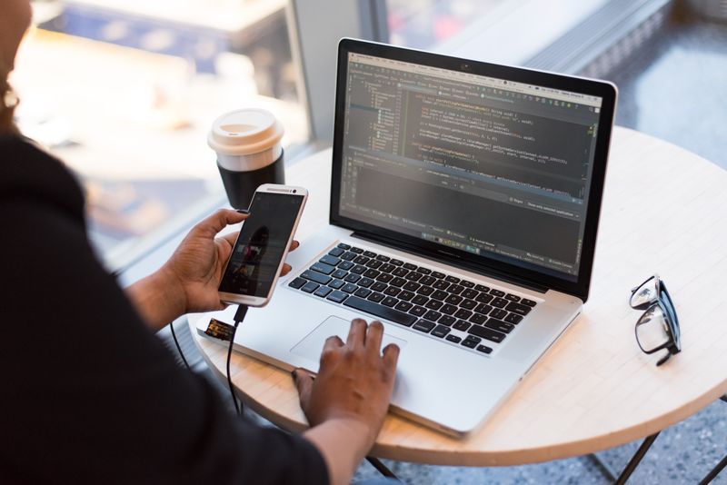 Teenager learning Python programming with beginner-friendly coding tools and AI assistance