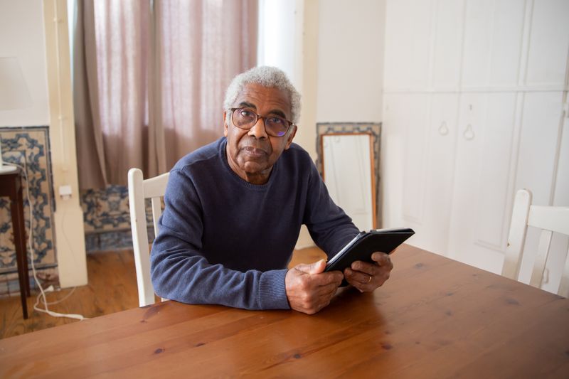 Senior adult engaging with lifelong learning technology for cognitive engagement and skill development