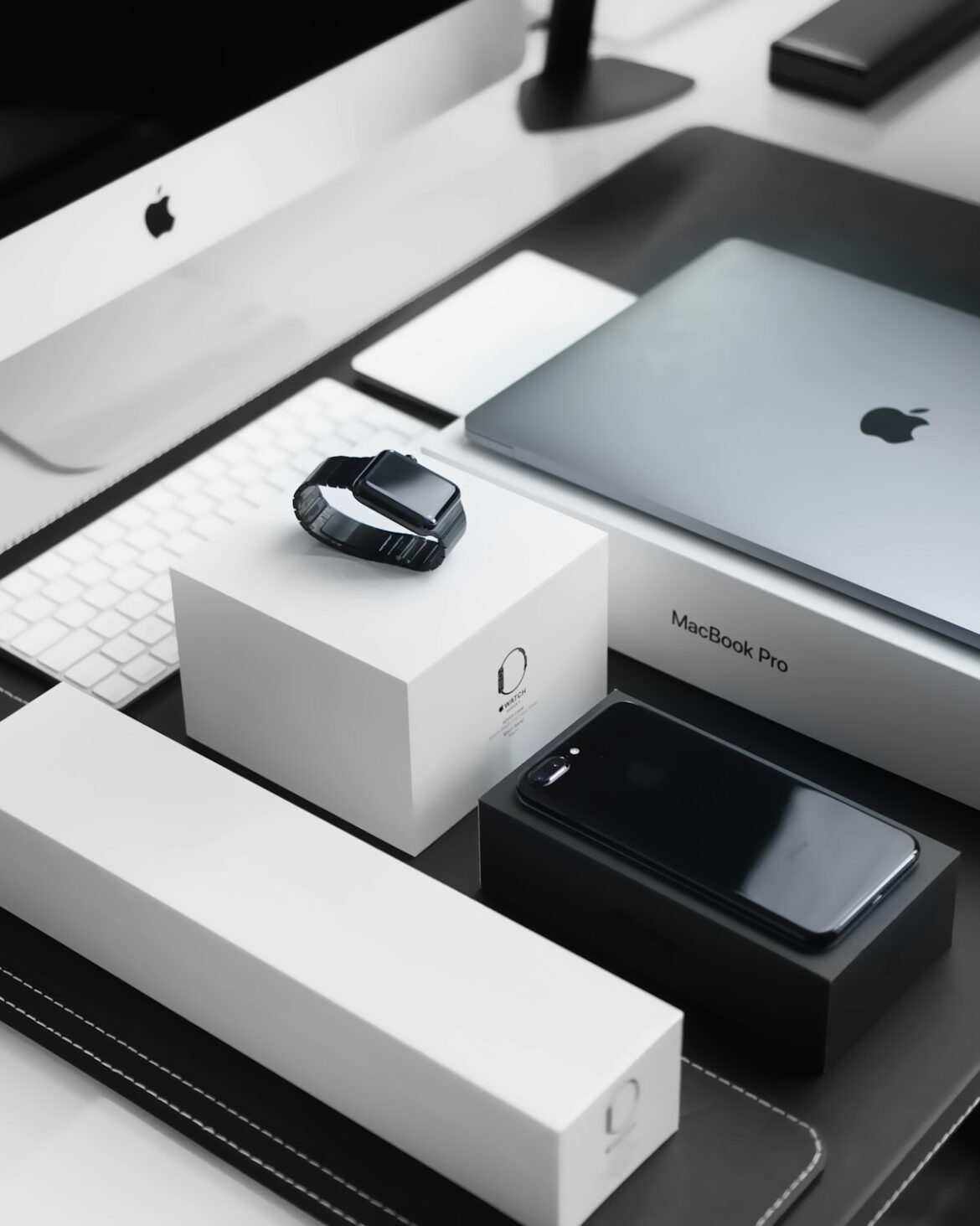 Apple MacBook laptop with iOS services ecosystem 2026